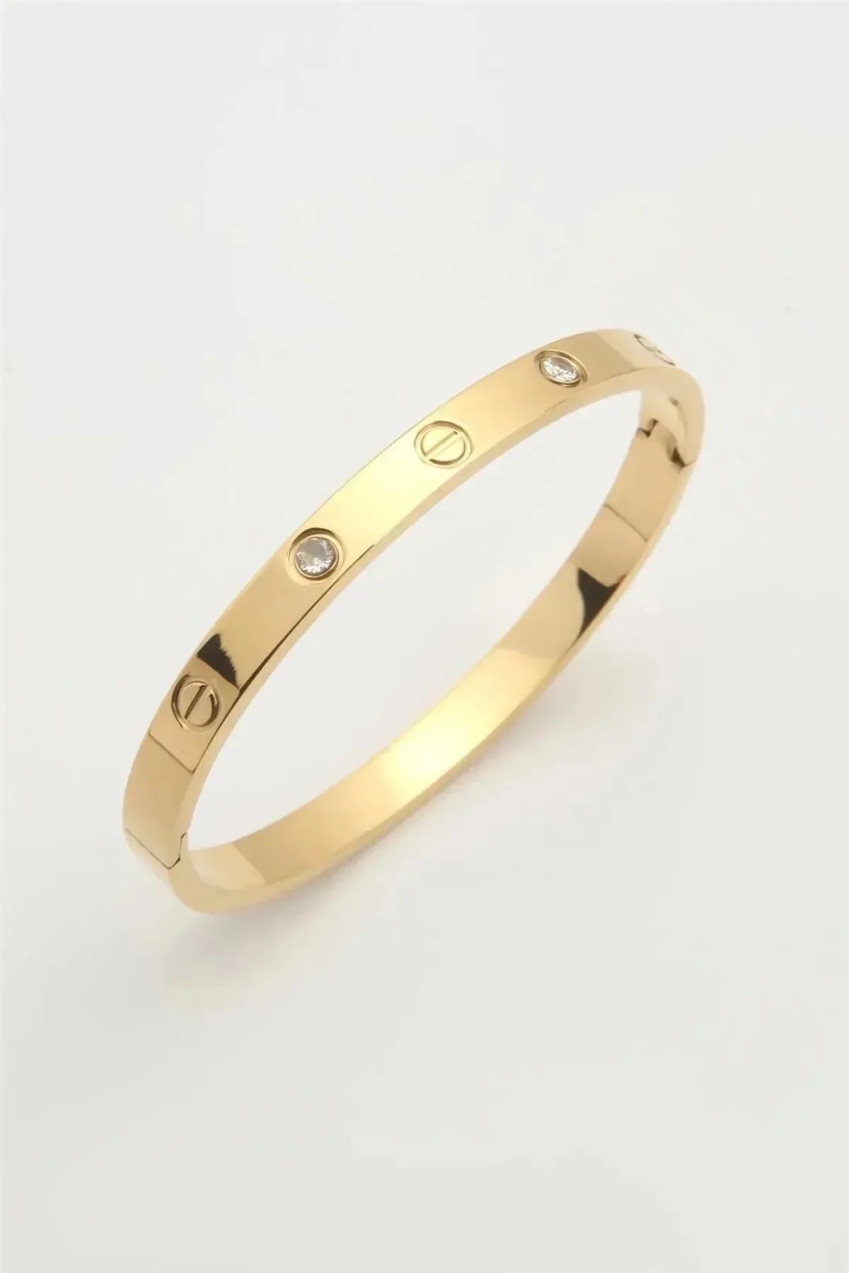 Gold bracelet with diamond accents and screw motif, Arabella Vibe jewelry collection